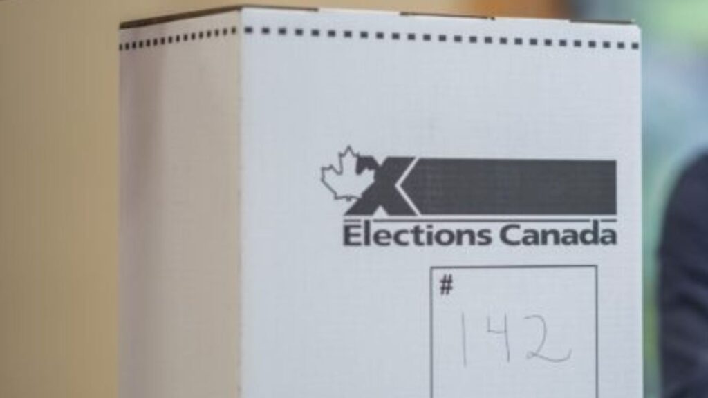 An elector casting a ballot at an Elections Canada box. | Elections Canada photo