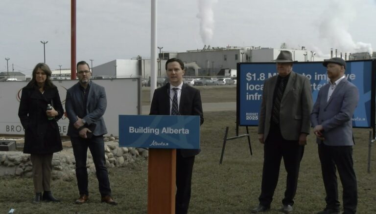 Alberta government representatives - including Innisfail-Sylvan Lake MLA and the province's Minister of Transportation and Economic Corridors, Devin Dreeshen - at a funding announcement on April 1, 2025 at the JBS Foods plant. (Galen Hartviksen, mymountainviewnow.com staff)