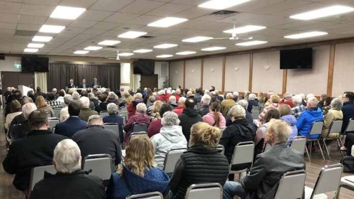 L-R: Larry Gratton of the People's Party of Canada, Forum Moderator Dan Harder with MVF Community Care Society, and Grant Abraham of the United Party of Canada on stage at the Ponoka-Didsbury election forum on April 17, 2025 at the Olds Royal Canadian Legion. (Galen Hartviksen, mymountainviewnow.com staff)