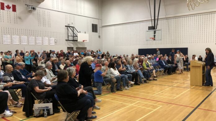 Premier Danielle Smith at the Holy Trinity Catholic School gymnasium on May 24, 2025. (Galen Hartviksen, mymountainviewnow.com)