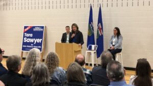 Premier Danielle Smith in Olds with Nathan Cooper and Tara Sawyer on May 24, 2025. (Galen Hartviksen, mymountainviewnow.com staff)