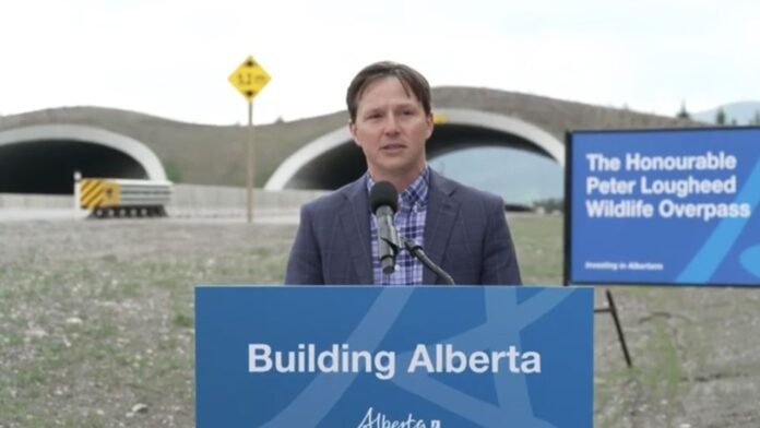 Devin Dreeshen, Alberta's Minister of Transportation and Economic Corridors, at dedication ceremony for wildlife overpass east of Canmore on June 13, 2025. (Galen Hartviksen, mymountainviewnow.com)