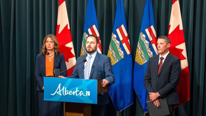 Alberta Education Minister Demetrios Nicolaides speaks at a news conference with Finance Minister Nate Horner and Premier Danielle Smith on Sept. 30, 2025. | Government of Alberta photo