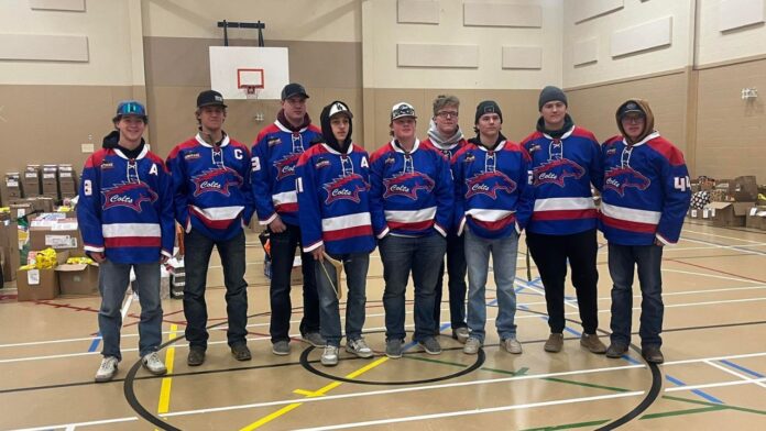 Mountain View Colts help out with 2025 Christmas food hamper program. (Heart 2 U Facebook page)