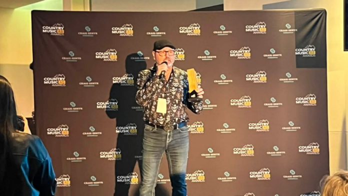 Sheldon Button with Vista Radio accepts for 96.5 The Ranch the 2026 Radio Station of the Year award in the Small/Medium Market category. (mymountainviewnow.com staff)