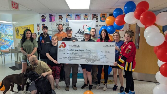 The Mountain View Hospice Society receives a cheque during the 2026 Hike For Hospice. (mymountainviewnow.com staff)