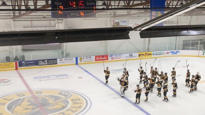 The Olds Grizzlys celebrate an opening night victory over Drayton Valley on September 18, 2026. (mymountainviewnow.com staff)